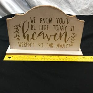 Wooden memorial plaque.We know you’d be here today if heaven weren’t so far away